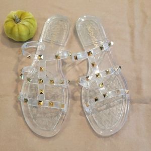 Clear, gold-studded jelly slides